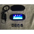 PS Vita Console - with charger and games