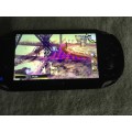 PS Vita Console - with charger and games