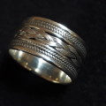SOLID STERLING SILVER RING.  SIZE U.  10.5 MM WIDE.