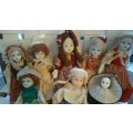 A Collection of 12 Vintage doll, 9 Porcelain and 3 Plastic