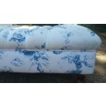 Gorgeous! A Double Seater Ottoman with Deep Pressed Buttons Upholstered in a fabric Blue/White Roses