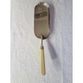 A Vintage EPNS Crumb Scoop with Silver Collar and Ivory Style Celluloid Handle