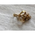 9ct Gold Fleur De Li pendant set with small round garnets