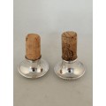An Outstanding Pair of Silver and Cork Wine Bottle Stoppers