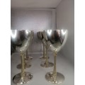 AN OUTSTANDING SET OF SIX SILVER AND GILT WINE GOBLETS