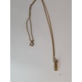 A  BEAUTIFUL SMALL  GOLD PLATED BAR PENDANT WITH A CZ ON A MARKED CHAIN ,