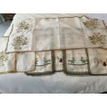 A SELECTION OF EIGHT VINTAGE PLACEMATS ,RUNNER AND TRAYCLOTHS