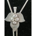 A PRETTY SILVERTONE?? CHAIN WITH AN ADJUSTABLE LEAF PENDANT