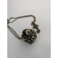 A TIBETIAN SILVER TONE PERFUME/OIL PENDANT WITH AGATES ON A SILVER CHAIN