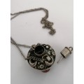 A TIBETIAN SILVER TONE PERFUME/OIL PENDANT WITH AGATES ON A SILVER CHAIN