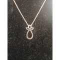 A BEAUTIFUL DAINTY BROWNS 9K ROSE GOLD NECKLACE AND PENDANT.