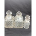 THREE CRYSTAL PERFUME BOTTLES WITH STERLING SILVER COLLAR`S
