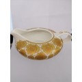 A Beautiful Jenna Clifford cream and gold milk jug.