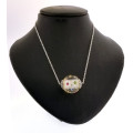 CLEAR RESIN SWAROVSKI CRYSTAL  EMBEDDED PENDANT ON SILVER CHAIN. CLEAR WITH MULTI COLOURED CRYSTALS.