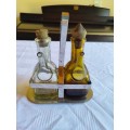 Stunning glass cruet set - vinegar and oil bottles in silver tone holder