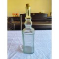 Beautiful light green vintage style square shaped bottle with cork