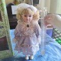 Gorgeous vintage porcelain doll in original box
