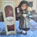 Gorgeous vintage porcelain doll in original box