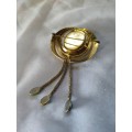 Very interesting gold tone brooch with green stones