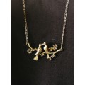 Truly stunning necklace with two birds as pendant