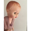 VINTAGE BABY RUBBER TYPE DOLL WITH ORIGINAL CLOTHES MOVING EYES AND LETTER  J ON NECK
