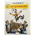 A LUCKY LUKE ADVENTURE - THE PROMISED LAND PAPER BACK 2017  - AS NEW