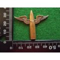 Unknown winged bullet badge. (no lugs)