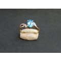 ** EXQUISITE:  9ct Yellow Gold and Oval Cut Blue Topaz Ring (1.46ct) w/ Two Melee Diamonds .**