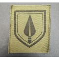 **Rhodesian Bush War: 1970s Pfumo Re Vhanu Green Auxiliary Cap Badge (UNISSUED**