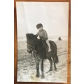 POSTCARD POST CARD POSKAART PHOTOGRAPH of a youg BOY RIDING A PONY/HORSE on the BEACH 1930