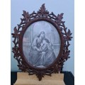 STUNNING ANTIQUE OVAL CARVED WOODEN FRAME..(JESUS ND CHILD BLACK ND WHITE PHOTO