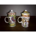 TWO GORGEOUS CERAMIC/PORCELAIN CHINESE TEA MUGS WITH STRAINERS AND LIDS