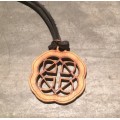 Gratitude wooden pendant on a leather thong