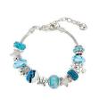 Charming turquoise and silver colour bracelet with sea themed charms