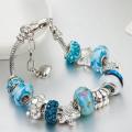 Charming turquoise and silver colour bracelet with sea themed charms