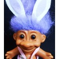 collectable Troll doll in baby suit with bunny ears
