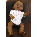 Black baby doll same size as Zapf Baby Born doll no markings