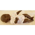 Black baby doll same size as Zapf Baby Born doll no markings