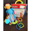 Colourful toys for small babies made by TINYLOVE to hook on crib or carriage