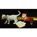 collectable Baby Puma and Schleich white lion cub walking.