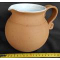 Beautiful classic shape terracotta jug with white glaze inside from Italy