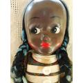 vintage brown cloth/rag doll with a celluloid/ plastic face looks like a Deans ragbook doll