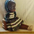 vintage brown cloth/rag doll with a celluloid/ plastic face looks like a Deans ragbook doll