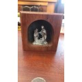 Wooden alter with baby jesus and Joseph and maria