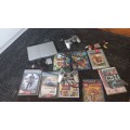 PS2 console with 8 games and 8mb card