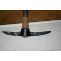 A Primitive Farmhouse Hand Forged Pick Ax. Very traditional, historic farm implement