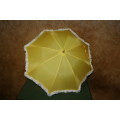 This is a neat vintage umbrella in vibrant yellow with a white trim stunning