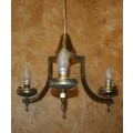A stately three tier Vintage chandelier . The beautiful 3-light Vintage fixture is stunning working