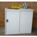 A GORGEOUS CRISP WHITE SHABBY CHIC SLIDING DOOR CUPBOARD WITH A SHELF.