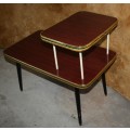 Vintage telephone table/stand. It features a gold colored legs & stunning retro chic tops.
